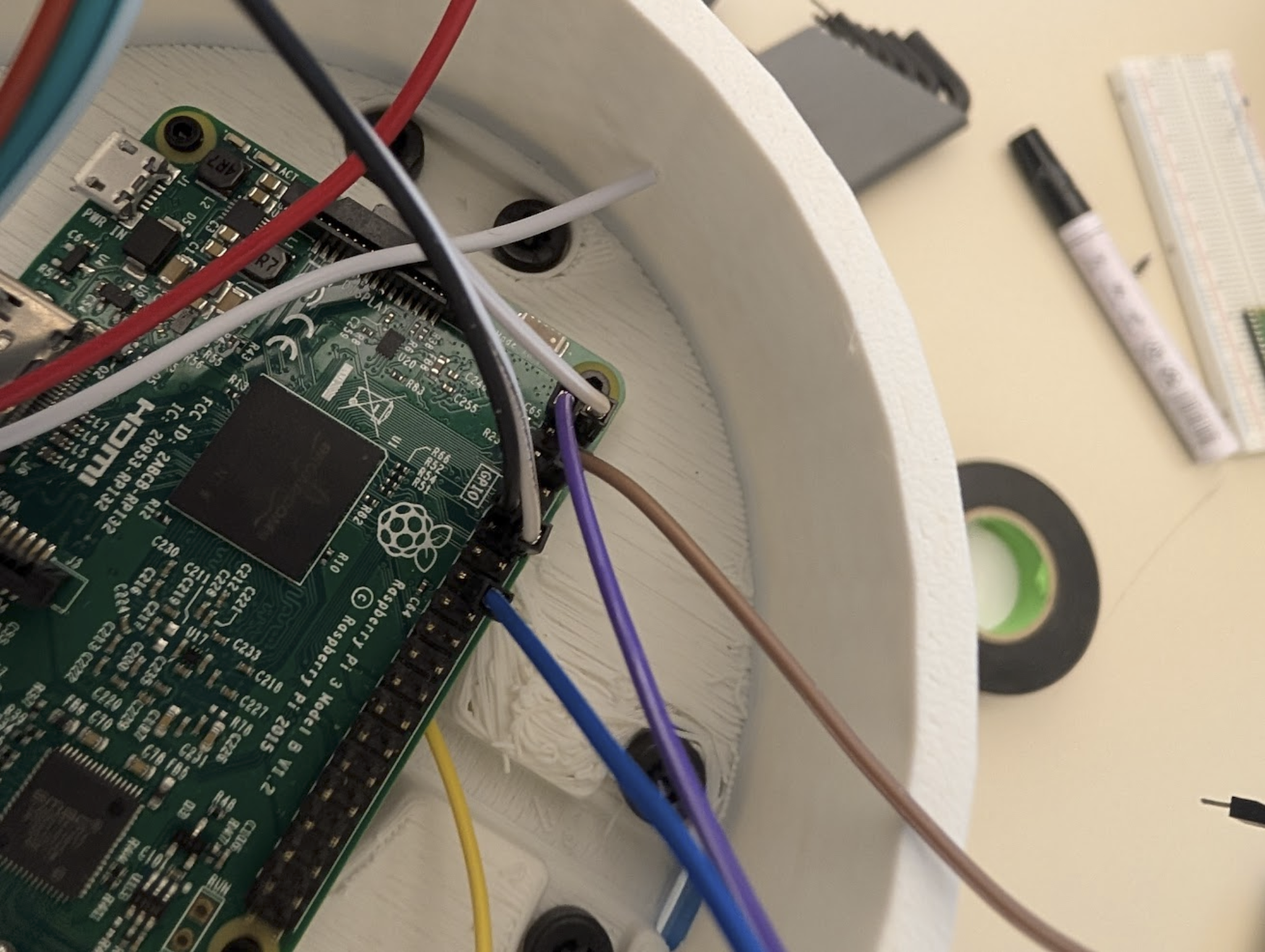 Close-up of Raspberry Pi wiring for switches and LED ring.
