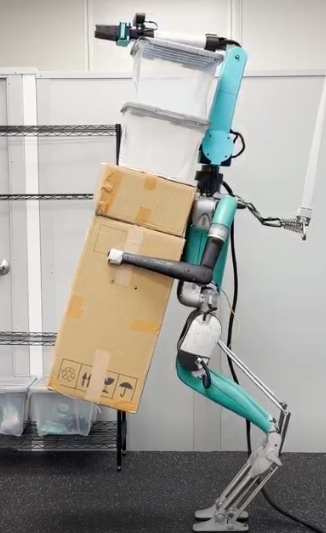 The lab's auxiliary arm mounted on its Agility Robotics Digit humanoid.